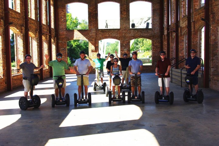 Group of segway riders inside a park building