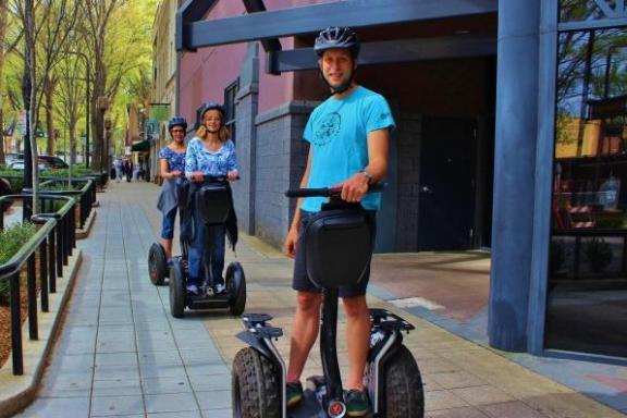 Guests riding Segway PTs through Uptown Charlotte