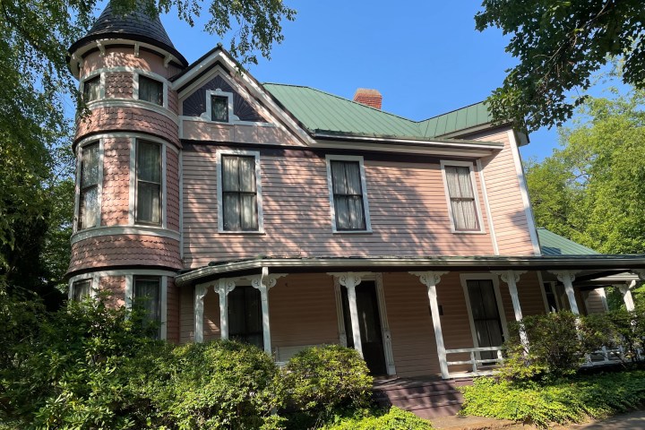 a house with trees in the background
