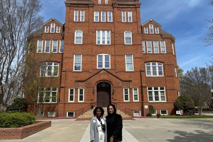 a small clock tower in the middle of a road