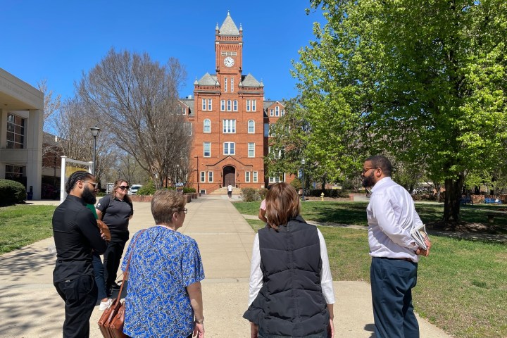 a group of people standing in front of a building