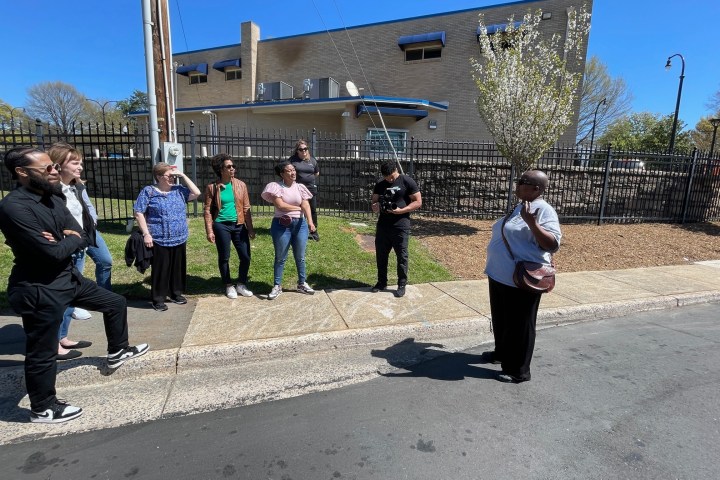a group of people standing outside of a building