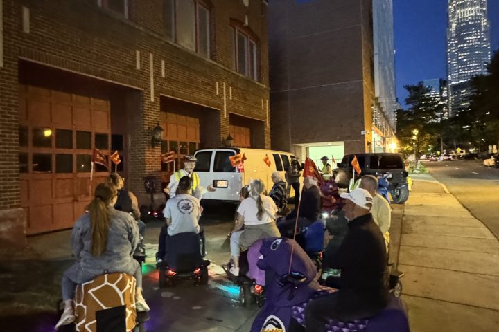 a group of people on a sidewalk