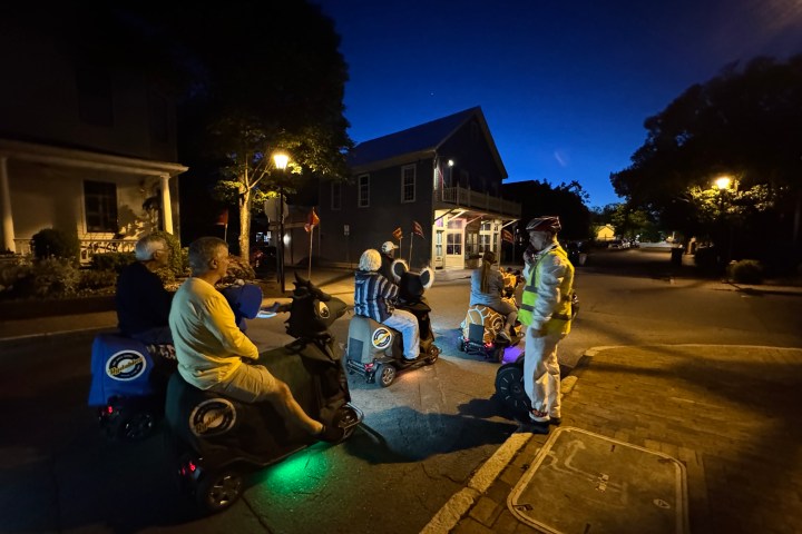 a man riding a skateboard up the side of a road