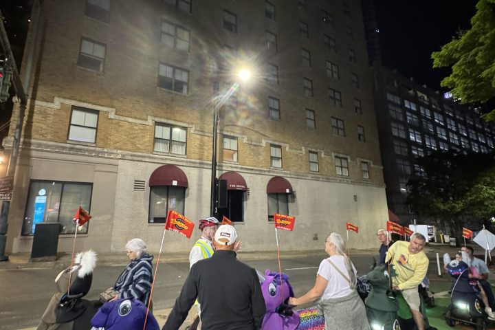 a group of people walking down the street
