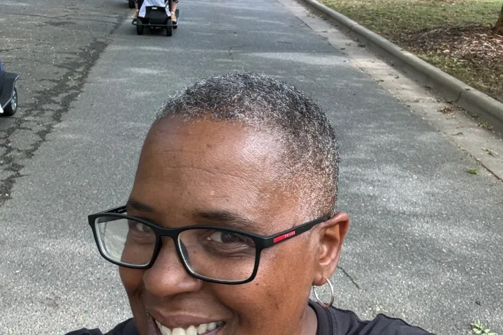 a man riding a skateboard up the side of a road