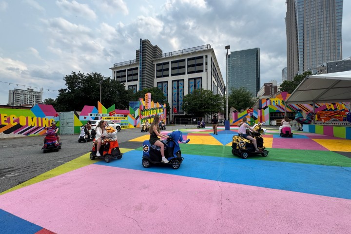 a group of people riding on top of a building