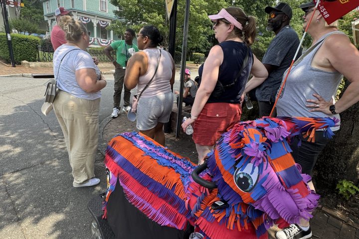 a group of people holding a sign